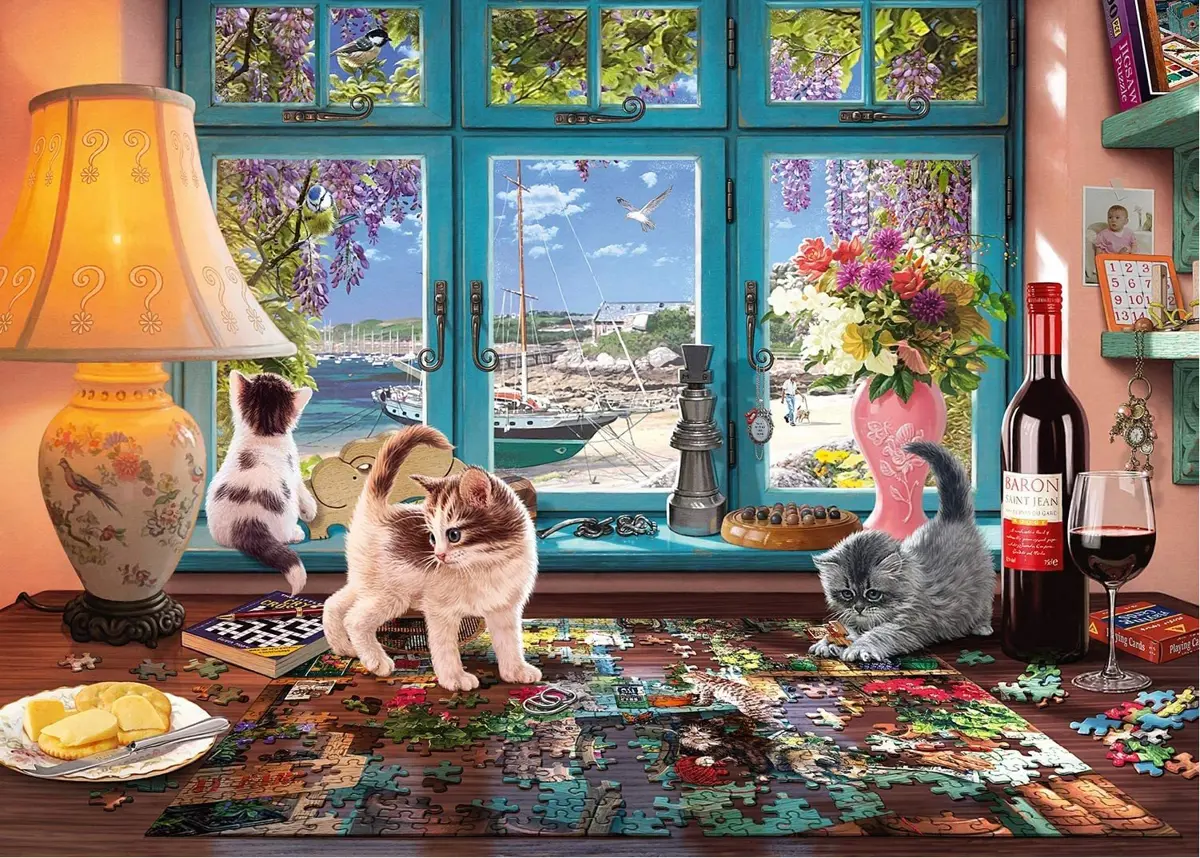 Puzzle Cica az asztalon a puzzle kirakóval